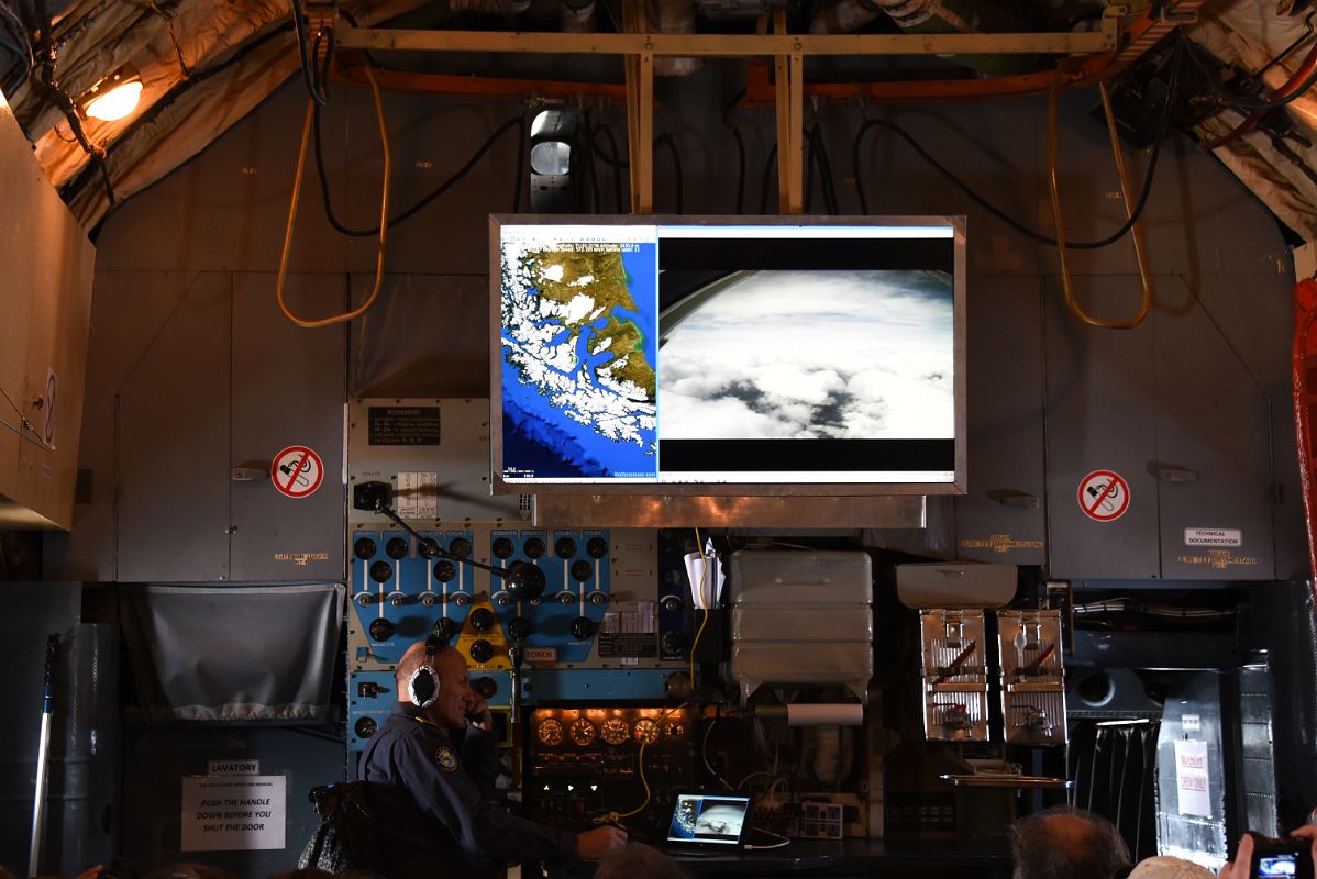 05A The Load Master With His Equipment And Screen At The Front Of The Air Almaty Ilyushin Airplane On The Way To Union Glacier In Antarctica